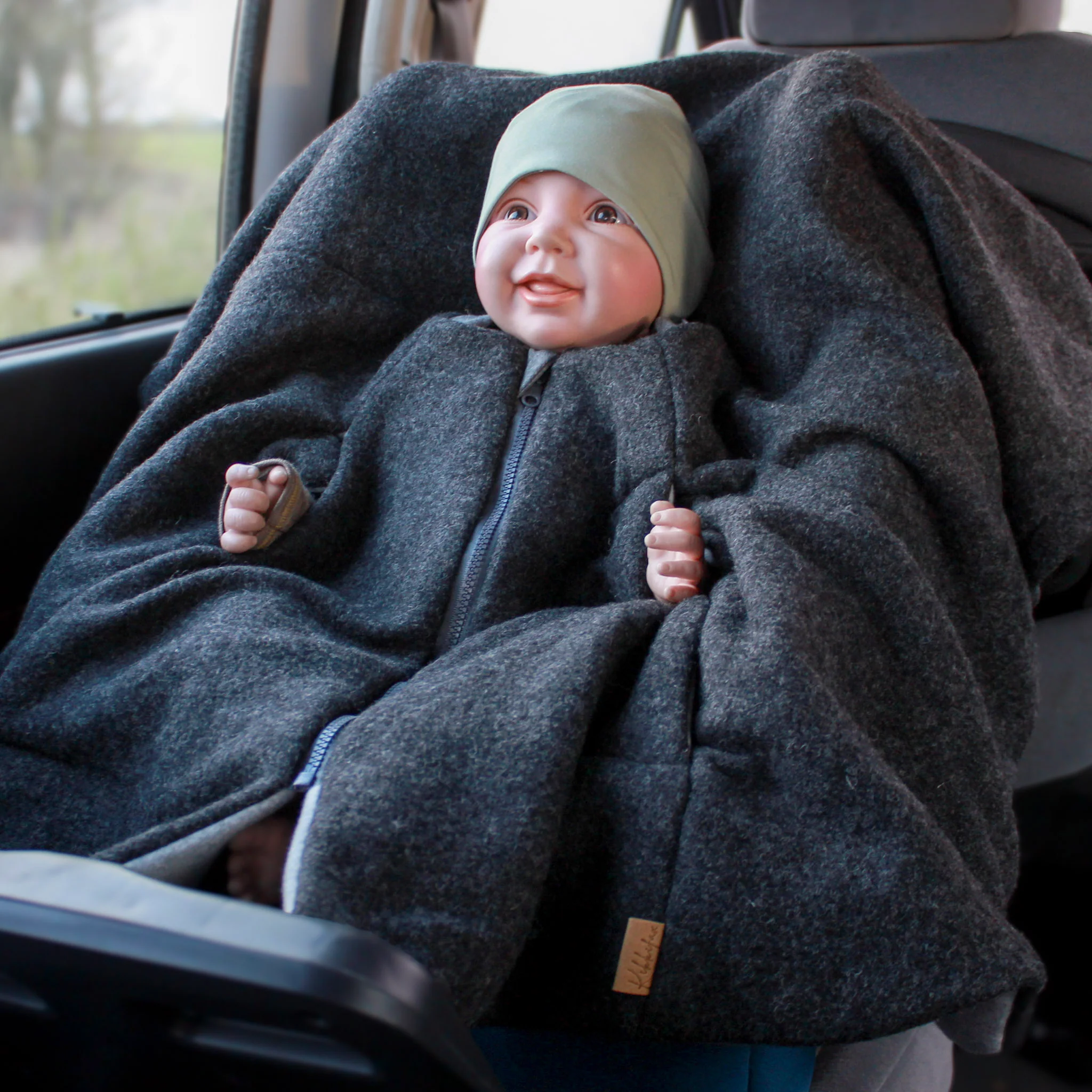 Kikkifax Kindersitzponcho aus Wollwalk