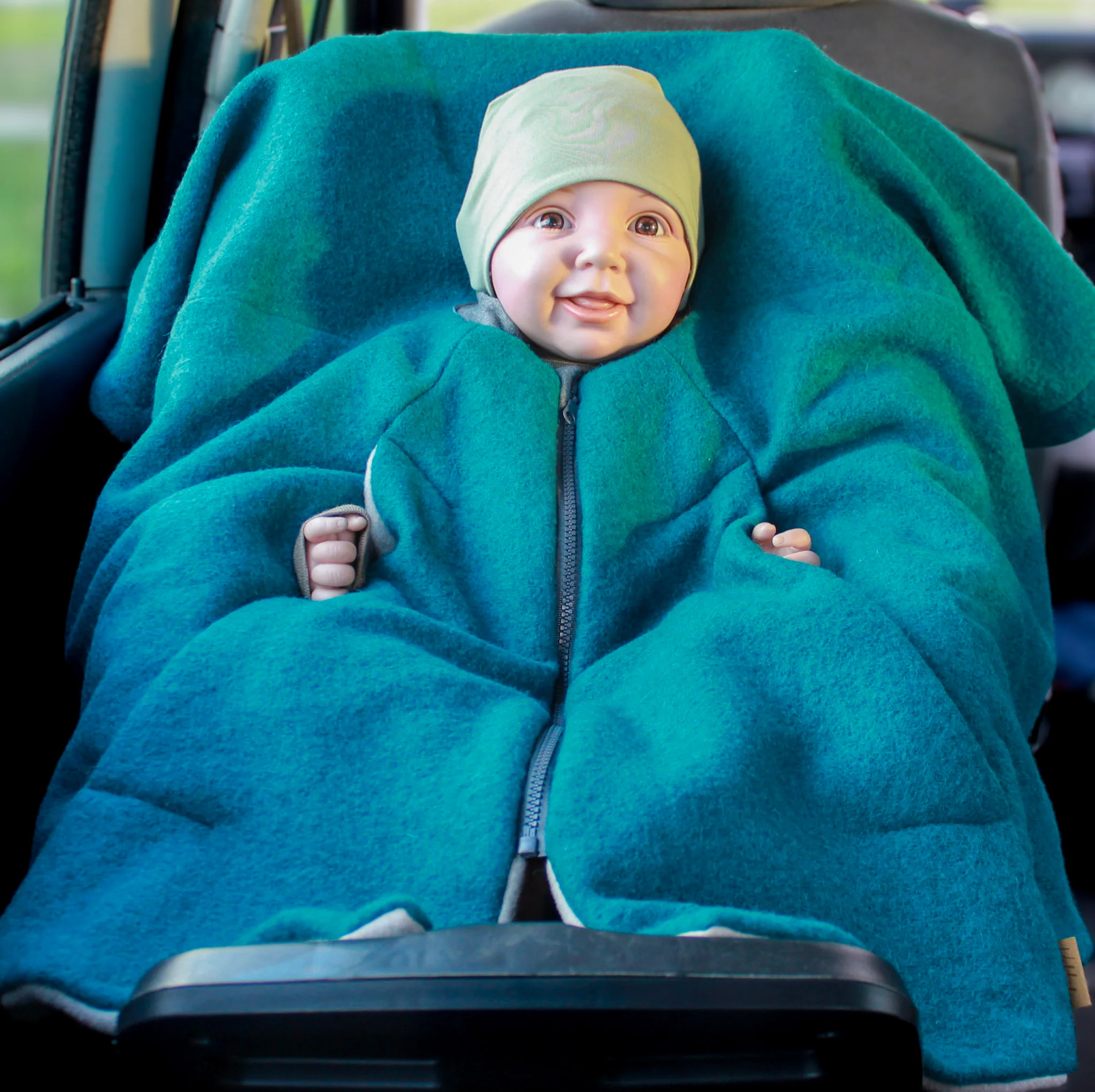 [504012-05] Kikkifax Kindersitzponcho aus Wollwalk (Türkis)