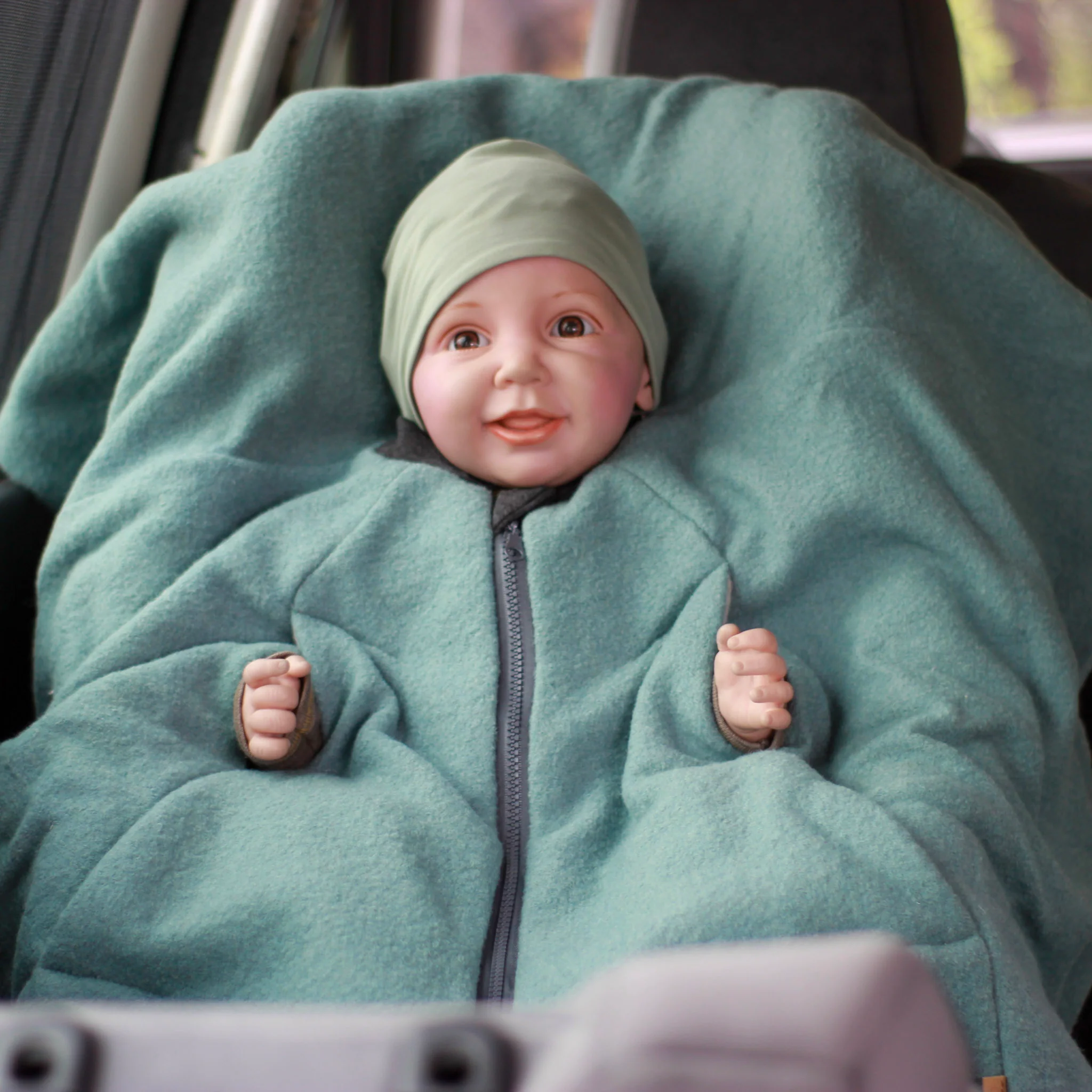 [504012-11] Kikkifax Kindersitzponcho aus Wollwalk (Pure Mint)