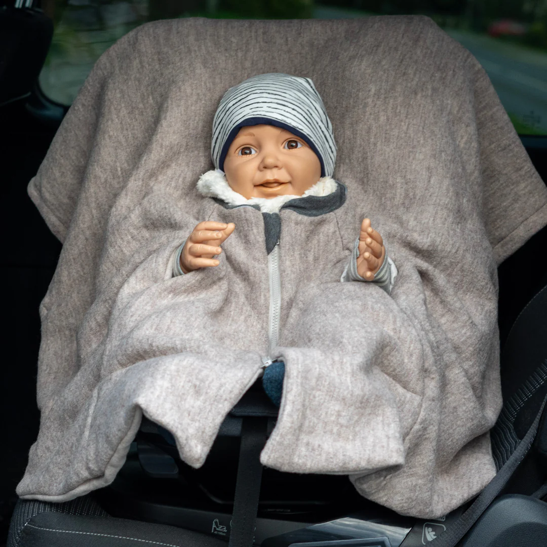 [504012-18] Kikkifax Kindersitzponcho aus Wollwalk (Creme)